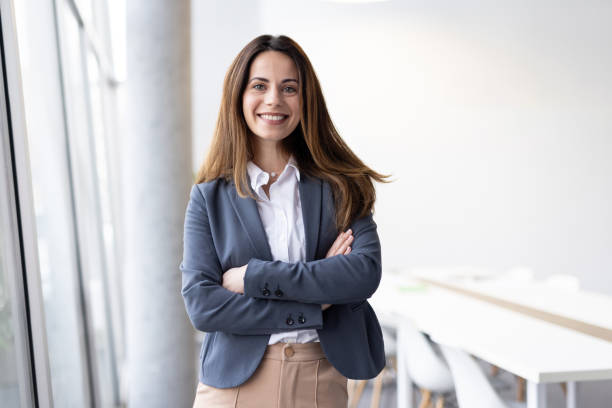 istock Confident Businesswoman Smiling in Modern Office Setting 2198603035