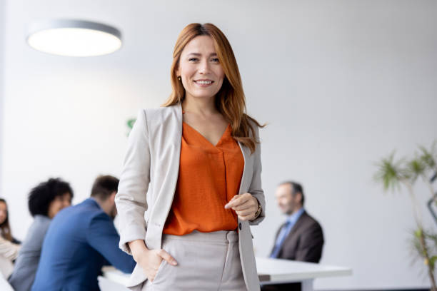 Confident professional woman shows positivity in office.