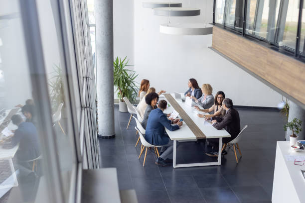 istock Team Discussing Strategies in Bright Office Environment 2198603052