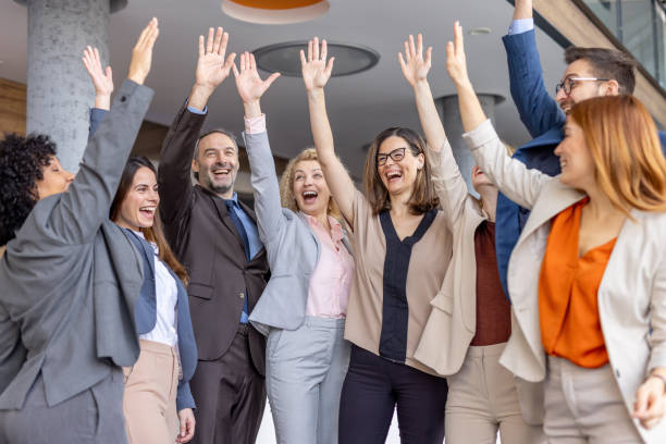 istock Happy Team Engaging in Celebration with Raised Hands 2198603059