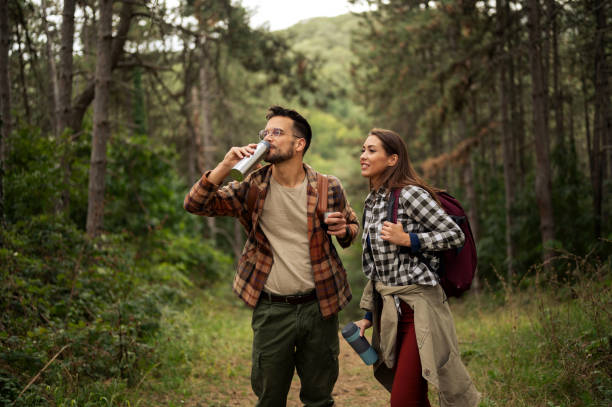 istock Beautiful young couple exploring nature 2198603255