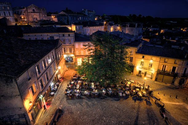 istock Nighttime dining in the charming streets of Saint Emilion with glowing lights and historic buildings 2198603268