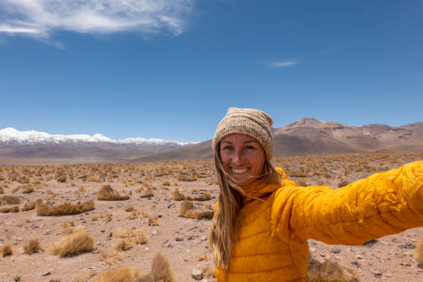 istock Woman Taking Selfie in Arid Desert Landscape 2198604810