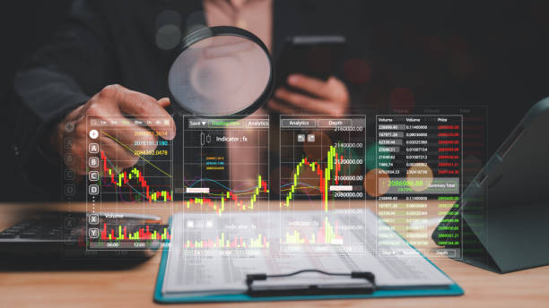 istock Data-Driven Investment Analyzing Financial Markets, Professional analyzing stock market data with advanced analytics through digital interfaces, highlighting importance of informed trading decisions 2198604870