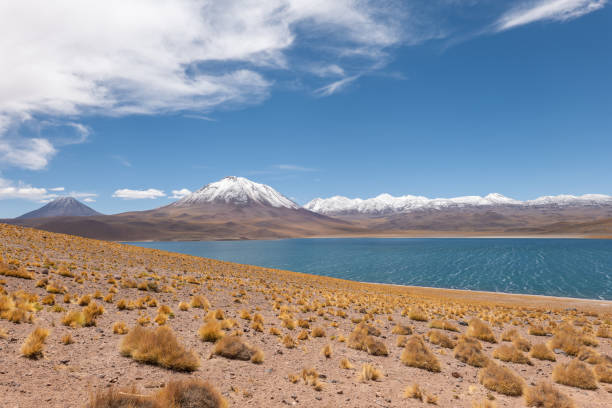 istock Majestic Mountain Range with Serene Lake Under Clear Blue Sky 2198604905