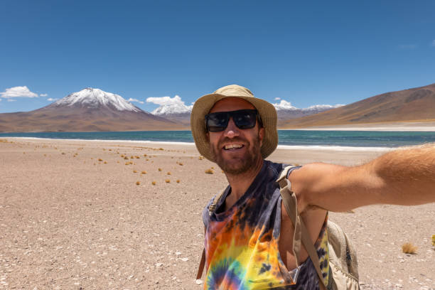 istock Adventurous Man Taking Selfie at Scenic Desert Landscape 2198605058