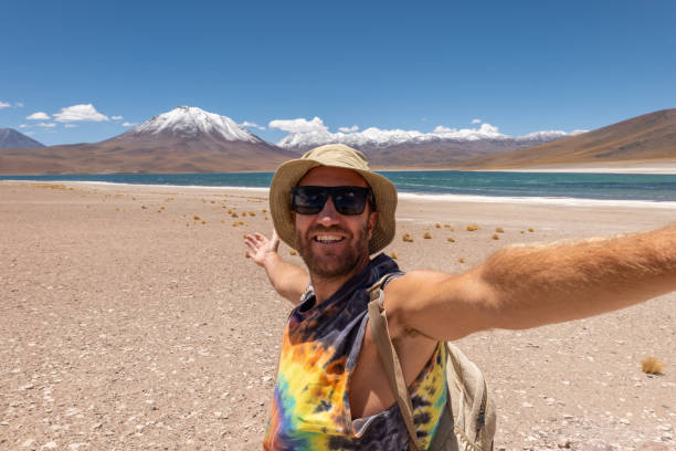 Adventurous Man Taking Selfie at Scenic Desert Landscape