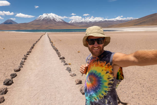istock Man Taking Selfie on Desert Path with Scenic Mountain View 2198605084