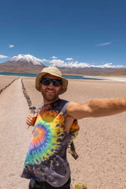 istock Traveler Taking Selfie on Desert Path with Mountain View 2198605489