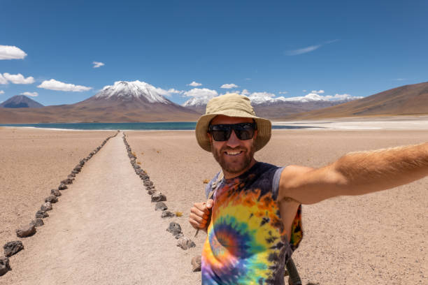 istock Traveler Taking Selfie on Desert Path with Mountain View 2198605791