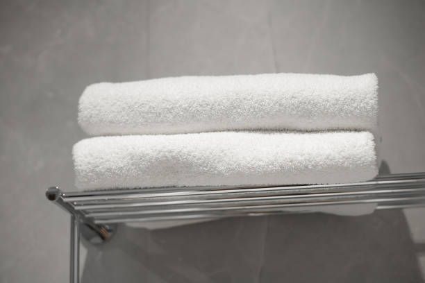 istock White towels in hotel bathroom, spa resort. 2198612462