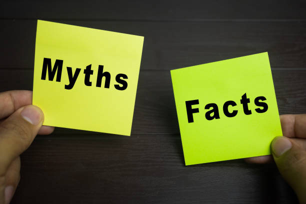 istock male hand holding myths and facts text message on sticky notes on the table 2198613139