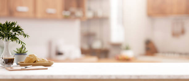 istock A kitchen tabletop with a blurred background of a minimalist kitchen. 2198616501