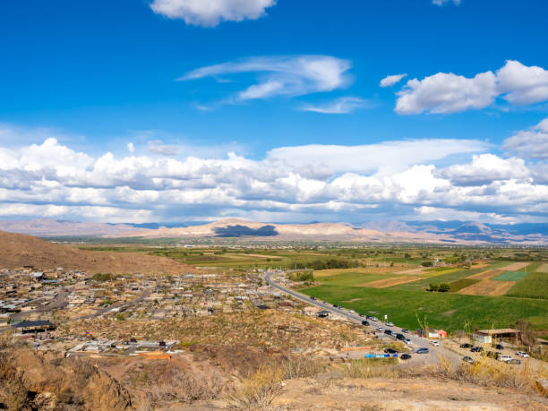 istock Scenery of landscape with small town with green fields on blue open sky and white clouds background in Armenia country, open view from hill near mount ararat and Khor Virap, an Armenian monastery. 2198617619