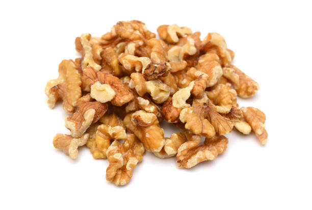 istock Close-up of shelled walnuts on white background 2198617803