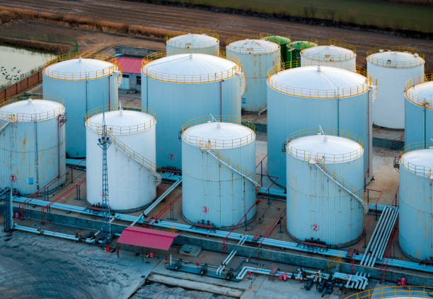 neatly arranged large cylindrical storage tanks