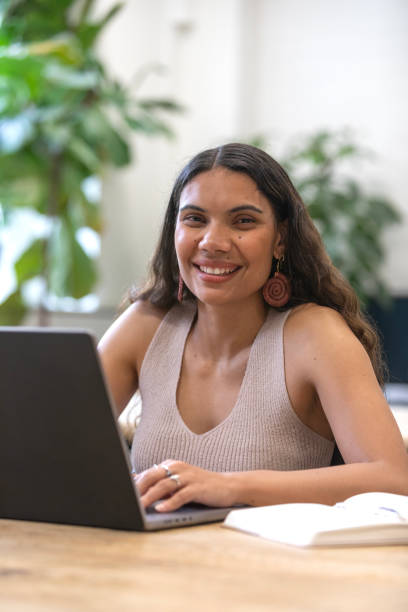 istock Australian aboriginal woman working at a laptop computer in a modern office 2198619721