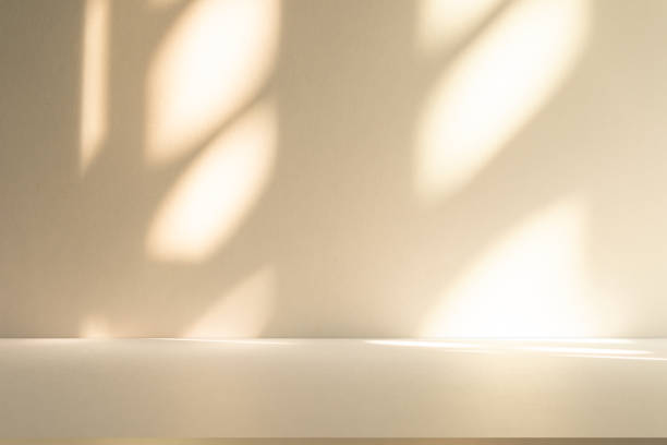 istock Studio style background wall decoration presentation uses white and beige tones. with shadows cast from a nearby window, concept creating a decorative 2198623892