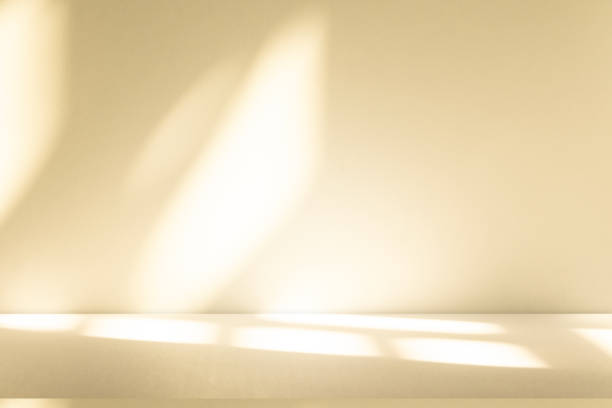 istock Studio style background wall decoration presentation uses white and beige tones. with shadows cast from a nearby window, concept creating a decorative 2198623896