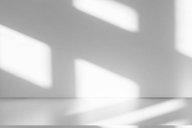 istock Wall interior background, studio and backdrops show products.with shadow from window color white . background for text insertion and presentation product 2198623903