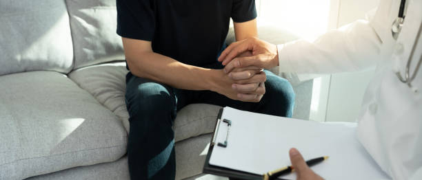 istock psychiatrist hold hand support each while discussing family issues. doctor encourages and empathy woman suffers depression. psychological, save divorce, Hand in hand together, trust, care 2198624264