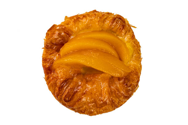 Top view of peach danish pastry isolated on white background with clipping path, closeup.