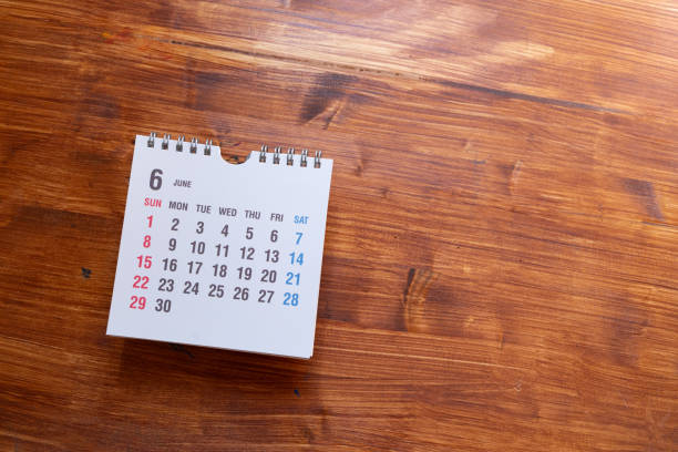 istock Desk calendar on wood background 2198628322