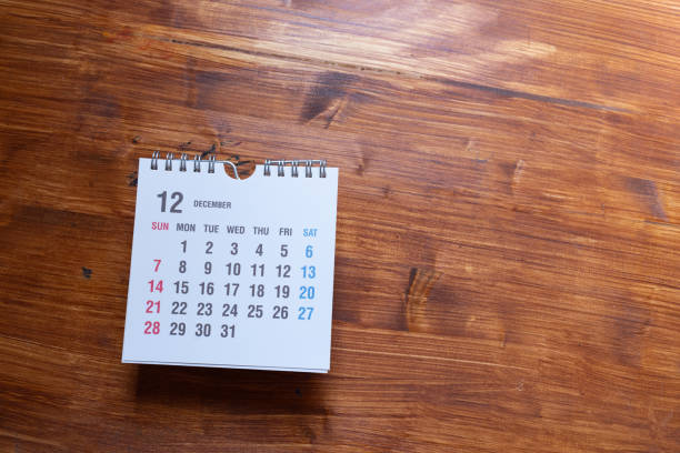 istock Desk calendar on wood background 2198628332