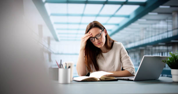 istock Young woman learns online in virtual webinar 2198632567