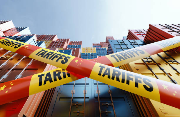 istock Economic Tariffs Against China And Trade War Concept  - Tariffs Written Tapes With Chinese Flags Before Cargo Containers 2198632789