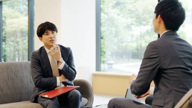 istock Asian businessmen having a meeting 2198633585
