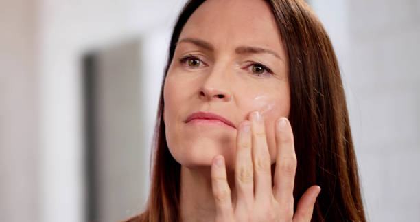 istock dermatologist applying anti-aging cream 2198634013