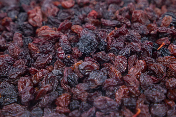 istock Raisins as background, closeup of raisins. Selective focus. 2198634562