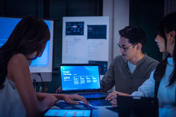 istock team of financial discussion budget planning, analyzing digital financial data and strategy in a modern office at night 2198634709
