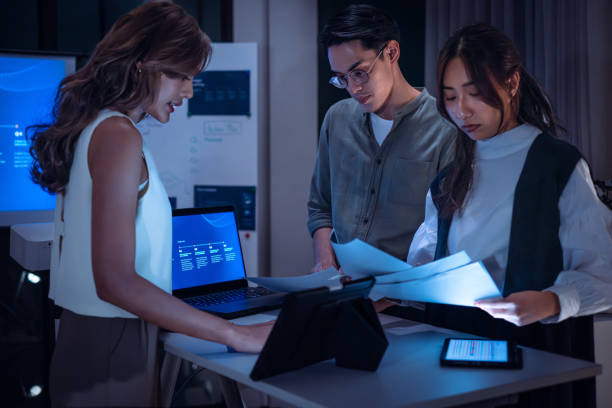 istock team of financial discussion budget planning, analyzing digital financial data and strategy in a modern office at night 2198634756
