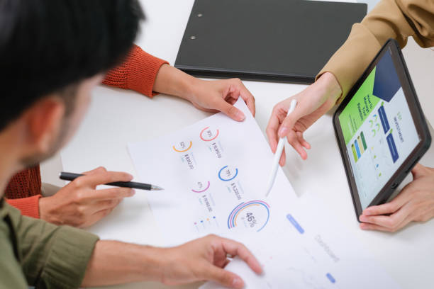 istock asian financial advisor presenting charts and data on a tablet during couple client meeting.financial planning and decision-making 2198634760