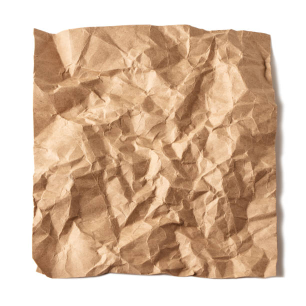 istock Crumpled brown craft paper isolated on white 2198636688