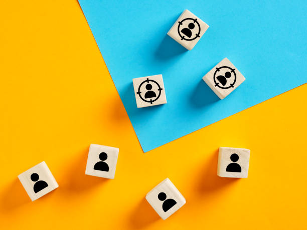 istock Targeting potential customers, customer retention and identification with wooden cubes on colorful background 2198636956