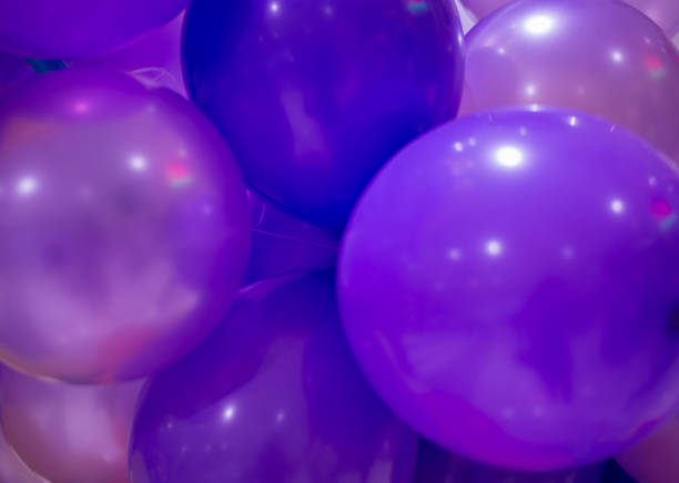 istock purple christmas balls on blue background 2198637585