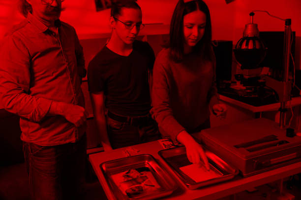 istock Students learn to develop photos under the mentorship of a professor 2198637877