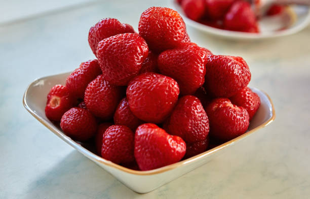 istock Juicy strawberries create a tempting centerpiece in a cozy kitchen space. 2198637893