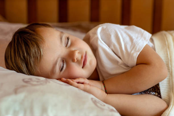 istock Baby sleeps in his bed 2198638130