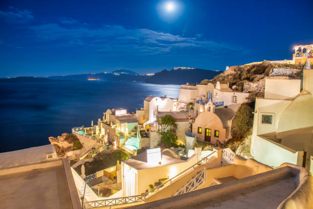 Santorini architecture glowing at night, creating a magical Aegean island atmosphere.