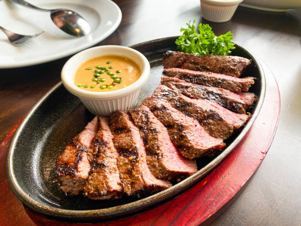 Sliced grilled medium rare Top sirloin beef steak