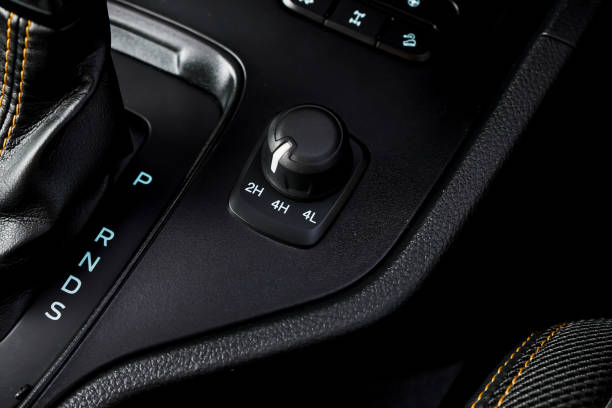 istock automatic transmission shift selector in the car interior. Closeup a manual shift of modern car gear shifter. 4x4 gear shift 2198641377