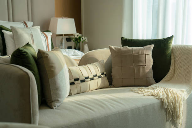 istock Cozy living space with decorative pillows and soft lighting 2198642951