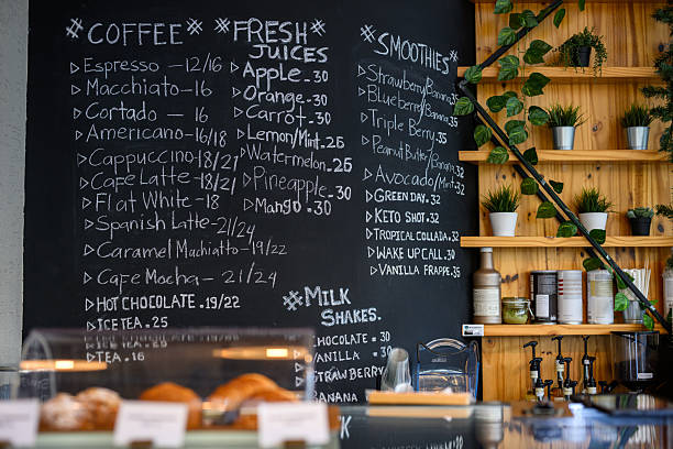 istock Still life of a cafe with a chalkboard menu and potted plants 2198643973