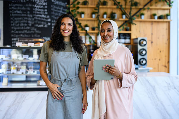 istock Portrait of two successful cafe owners standing together 2198644047