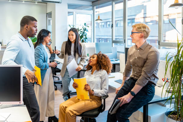 istock Diverse business team collaborating on project in coworking space 2198646137