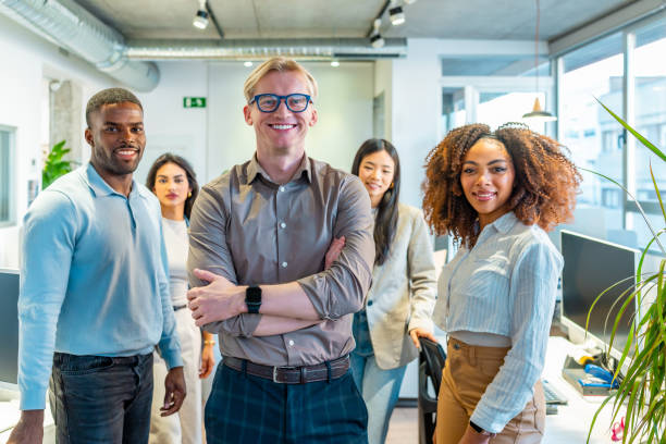istock Confident business team smiling in modern coworking office 2198646174